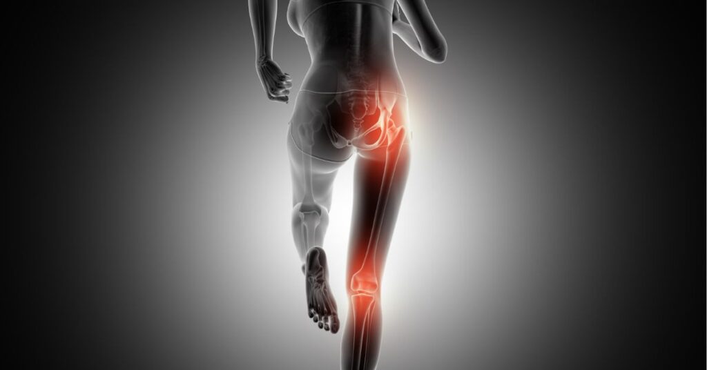 Person experiencing tingling from lower back to legs due to nerve compression and seeking medical evaluation